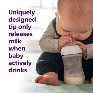 Baby drinking from a Philips Avent bottle with text about the bottle's design.