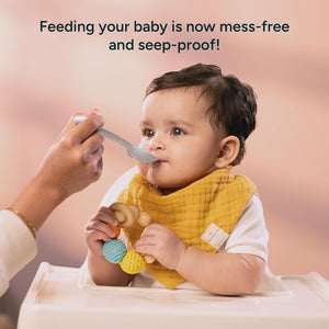 Baby being fed with a spoon, wearing a bib, with text 'Feeding your baby is now mess-free and seep-proof!' Nintara Baby Bandana Bibs Set of 2 Golden Flutter Pack go littles product image 7