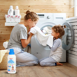 Woman and child with a bottle of Pigeon laundry detergent in a laundry room. Pigeon Baby Laundry Detergent Liquid 600ml go littles main image 6