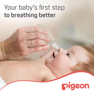 Baby being given a bottle with text 'Your baby's first step to breathing better' and Pigeon logo. Pigeon Nose Cleaner go littles product image 2