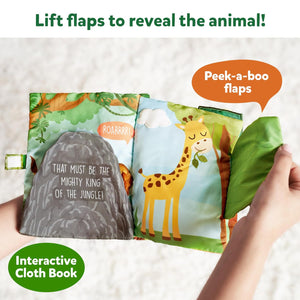 Skillmatics Peek A Boo i see you In the Jungle Soft Cloth Book at Go Littles product image 3. Interactive cloth book with animal illustrations and text, held by a hand.