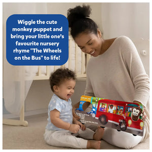 Skillmatics Puppet Book The Wheels on the Bus at Go Littles Stores product image 2. Mother and child playing with a book featuring a monkey puppet and bus illustration.