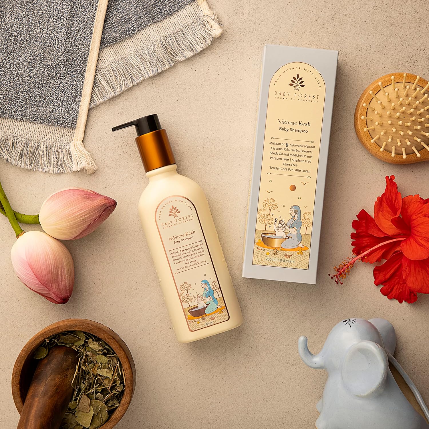 Baby Forest Baby shampoo bottle with packaging, flowers, and a mortar on a beige surface