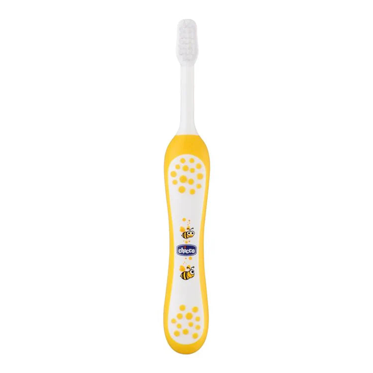Children's toothbrush with yellow handle and white bristles on a white background. Chicco Toothbrush Yellow 6M-36M go littles product main image
