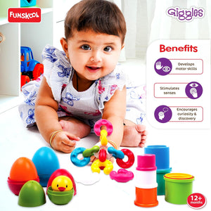 Funskool Giggles Link Stack N Nest Toy Set at go littles product image 5. Baby playing with colorful toys, surrounded by Funschool and Giggles branding, on a white background.