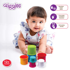 Funskool Giggles Stacking Drums at go littles product image 2. Baby playing with colorful stacking cups, featuring the brand 'Giggles'.
