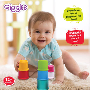 Funskool Giggles Stacking Drums at go littles product image 4. Baby playing with colorful stacking drums on a carpeted floor, with 'Giggles' branding visible.