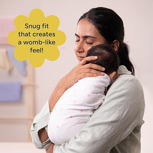 Woman holding a baby in a white wrap with text about a 'snug fit' feel. Nintara Organic Cotton Wake Me Not Swaddle  0-3 Months Butter Blossoms Go Littles product image 7