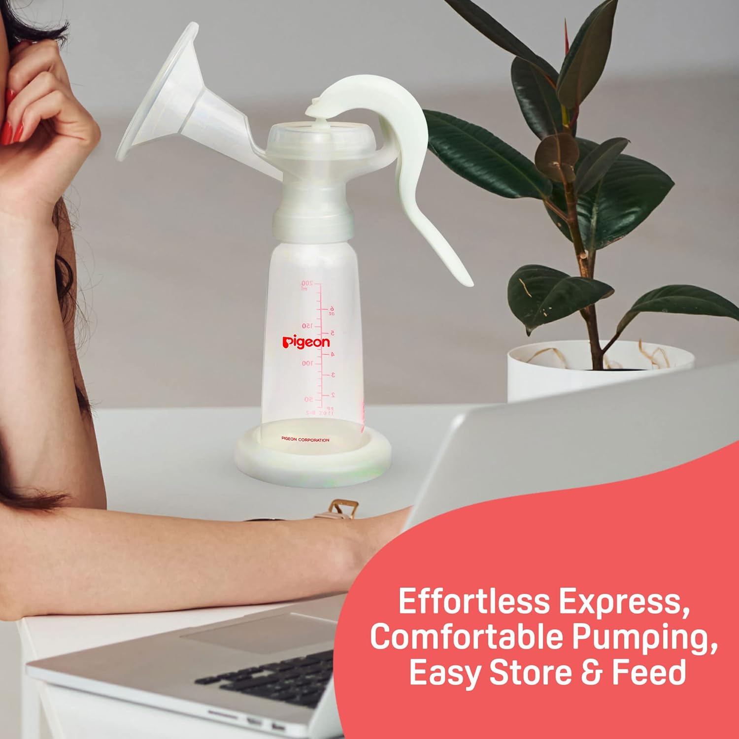 Pigeon breast pump on a desk with a laptop and plant, promotional text overlay. Pigeon Breast Pump Basic Edition go littles product image 6