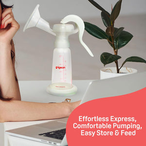 Pigeon breast pump on a desk with a laptop and plant, promotional text overlay. Pigeon Breast Pump Basic Edition go littles product image 6